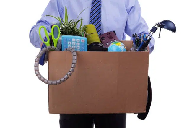 man carrying box full of office stuff