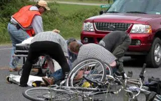 A group of people helping an injured man
